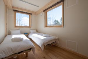 Llit o llits en una habitació de Himawari