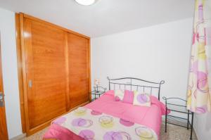 Postel nebo postele na pokoji v ubytování Apartment 3 minutes from Puerto Rico beach