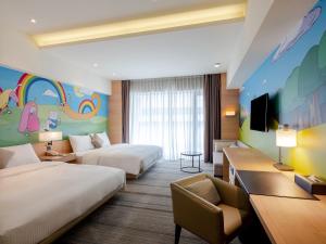 TV a/nebo společenská místnost v ubytování Hotel COZZI Ximen Tainan