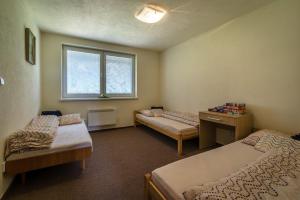 A bed or beds in a room at Classy Apartment - Telgárt Resort