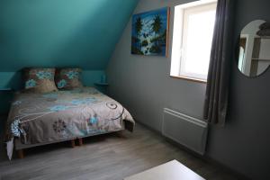Postel nebo postele na pokoji v ubytování Gîtes De Saint Rémy