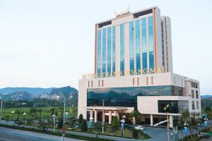 a building with a sign on top of it at Muong Thanh Grand Hoang Mai - Nghe An in Hoang Mai