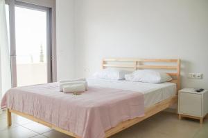 Postel nebo postele na pokoji v ubytování Legno Bianco