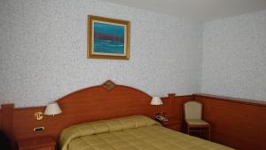 Cama ou camas em um quarto em Hotel Concordia