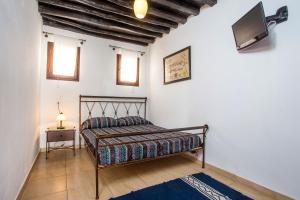 Un pat sau paturi într-o cameră la CasaLindos Festa