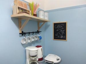 a kitchen with a counter with a coffee maker at Sunny Living in Loutraki +27 photos