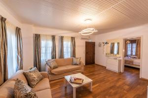 a living room with a couch and a table at Anastasia House in Panagia