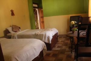 Postel nebo postele na pokoji v ubytování Hotel Vision