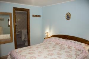 Postel nebo postele na pokoji v ubytování Anticarua B&B