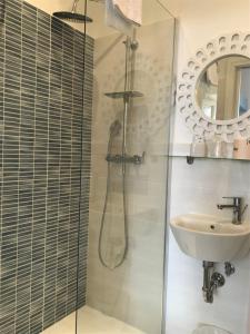 a bathroom with a shower and a sink at Il Miraggio in Fregene