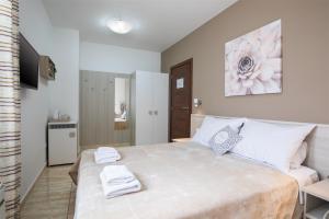 Postel nebo postele na pokoji v ubytování Apartments Villa Nina
