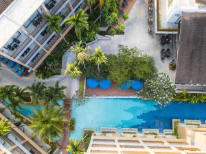 an overhead view of a pool with palm trees at Deevana Plaza Krabi Aonang - SHA Extra Plus in Ao Nang Beach