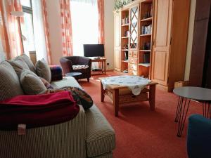 a living room with a couch and a coffee table at Ferienwohnung Burgblick in Traben-Trarbach