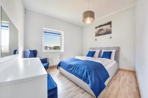 Posteľ alebo postele v izbe v ubytovaní Apartamenty Sun & Snow Seaside Grzybowo