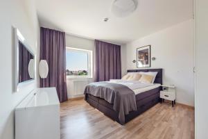 Posteľ alebo postele v izbe v ubytovaní Apartamenty Sun & Snow Seaside Grzybowo