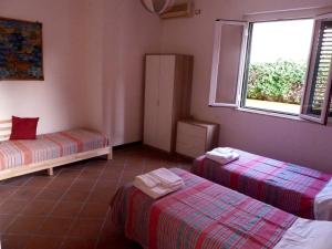 Кровать или кровати в номере Villa Asmara