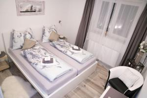 Posteľ alebo postele v izbe v ubytovaní Pension & Restaurant La Amalia