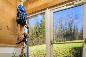 a window with a view of the woods at Hotel Kleins Wiese in Schmallenberg