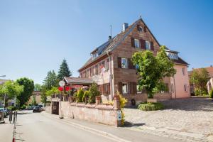 a large building on the side of a street at Hotel zum Rednitzgrund in Stein