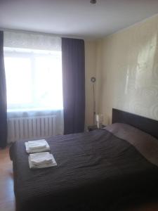 En eller flere senge i et værelse på Butas Vilniaus alėjoje