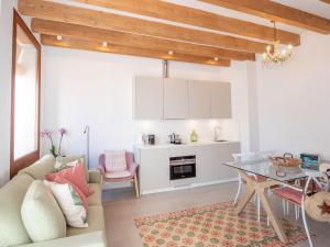 a living room with a couch and a table at Es Palauet New duplex in Ibiza center with Dalt Vila views in Ibiza Town