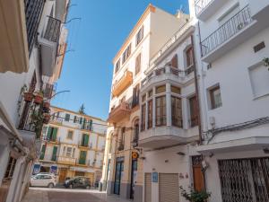 a row of buildings on a city street at Es Palauet Brandnew one suite apartment in Ibiza center in Ibiza Town