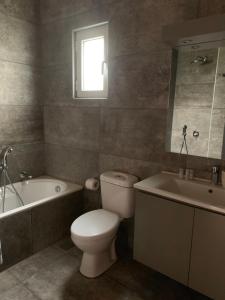 A bathroom at Anastasios Olive Garden Apartments