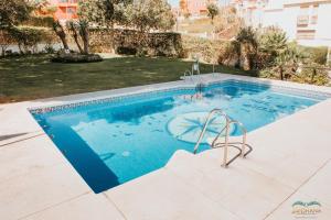 Bazén v ubytovaní Sol Ohana Apartamento Boutique alebo v jeho blízkosti