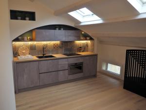 a kitchen with a sink and a stove at Suite Parolin in Marostica