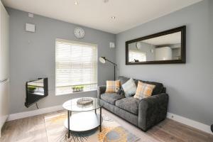 A seating area at Arena Apartments - Stylish and Homely Apartments by the Ice Arena with Parking
