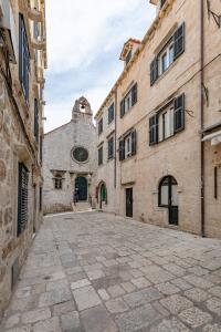 an empty alley in an old stone building at The Art Republic, Old Town in Dubrovnik