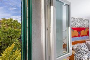 a window in a room with a view at The Art Republic, Old Town in Dubrovnik +5 photos
