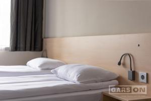 Postel nebo postele na pokoji v ubytování GarsON