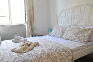 Postel nebo postele na pokoji v ubytování Sunrise Hostel & Rooms + 21 fotografií