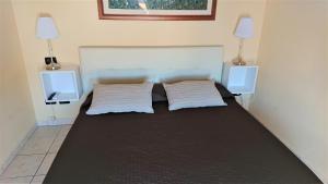 Postel nebo postele na pokoji v ubytování Guest House Brezza Marina