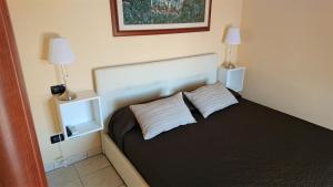 Postel nebo postele na pokoji v ubytování Guest House Brezza Marina