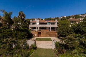 an aerial view of a house with a yard at Sunrise Bay Self Catering in Plettenberg Bay