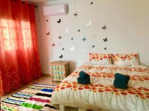 Cama o camas de una habitación en Finca Arcoíris Tenerife VV