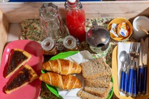 a table topped with a plate of sandwiches and bread at B&B Sotto le Stelle in Fano