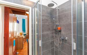 a bathroom with a shower with a glass door at The Art Republic 2, Old Town in Dubrovnik