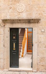 an entrance to a building with a door and stairs at The Art Republic 2, Old Town in Dubrovnik