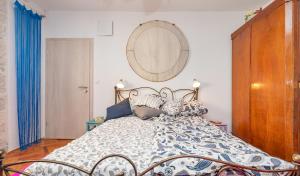a bedroom with a bed with a mirror on the wall at The Art Republic 2, Old Town in Dubrovnik
