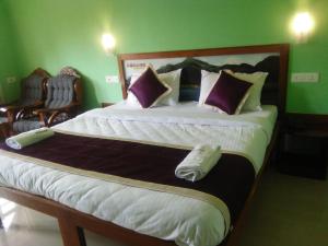 A bed or beds in a room at Konark Homestay