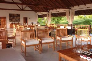 een restaurant met veel stoelen en tafels bij Ocean Lodge Resort in Cap Skirring