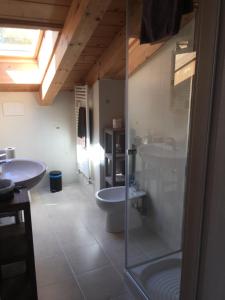 a bathroom with two sinks and a toilet and a shower at Ca' di Bianca in Moneglia