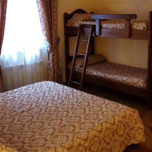 a bedroom with two bunk beds and a window at Affittacamere Mazzini 78 in Grosseto