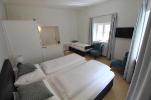 A bed or beds in a room at Maria von Buol - Wohnen in Kaltern