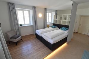 A bed or beds in a room at Maria von Buol - Wohnen in Kaltern