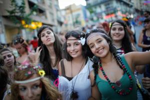a group of women standing in a crowd on a street at Hotel Maravillas del Mundo in Calpe