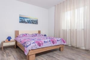 Postel nebo postele na pokoji v ubytování Apartments & Rooms Seaside